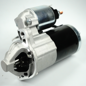 Mitsubishi 380 starter motor showing the black motor body, silver mounting housing and upper solenoid